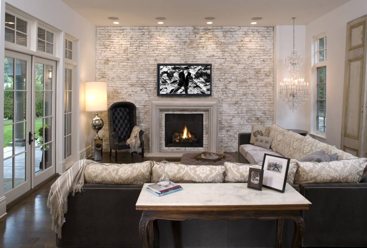 chic living room design with white and gray-washed accent brick wall