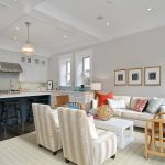 open-style traditional kitchen and living room with Benjamin Moore balboa mist 1549 warm gray wall paint color
