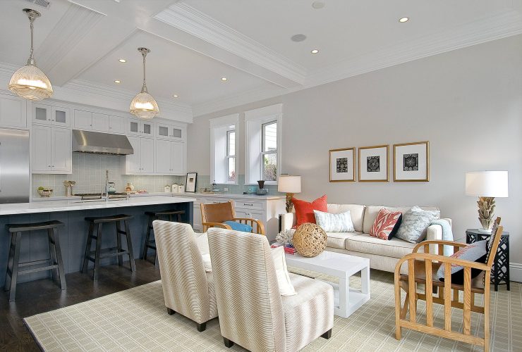 open-style traditional kitchen and living room with Benjamin Moore balboa mist 1549 warm gray wall paint color