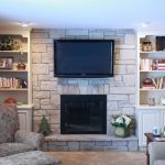 family room after being remodeled with new floor to ceiling fireplace design