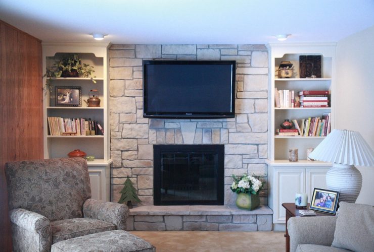 family room after being remodeled with new floor to ceiling fireplace design