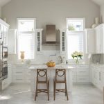 mediterranean kitchen with white cabinets and greige Sherwin Williams SW 7647 Crushed Ice wall paint color