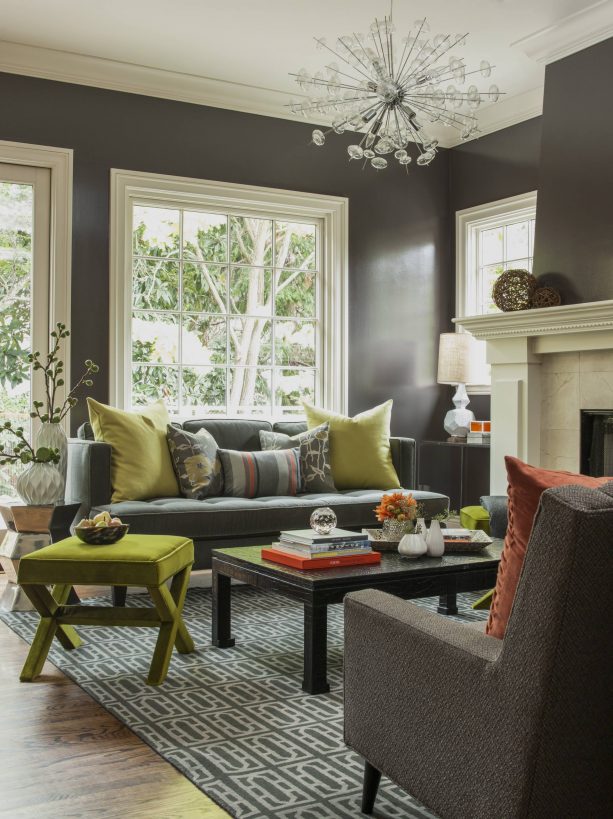 fun contemporary living room with ash gray wall and brown cedar sofa with olive green pillows