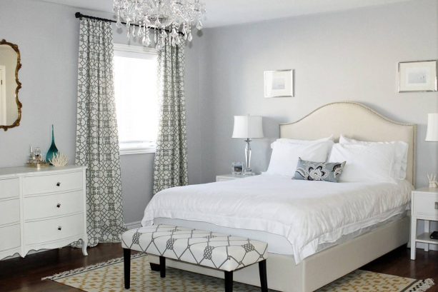 bedroom with grey wall and warm white bed