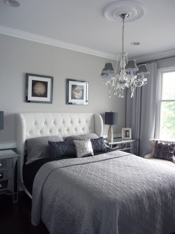 bedroom with grey wall and white bed