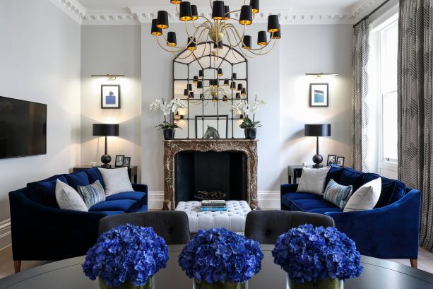 grey and blue living room with velvet navy blue sofa