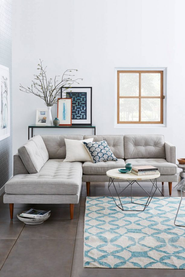 grey and blue living room with white background wall