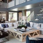 grey and blue open living room with a blue-grey wall