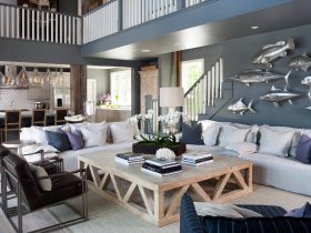grey and blue open living room with a blue-grey wall