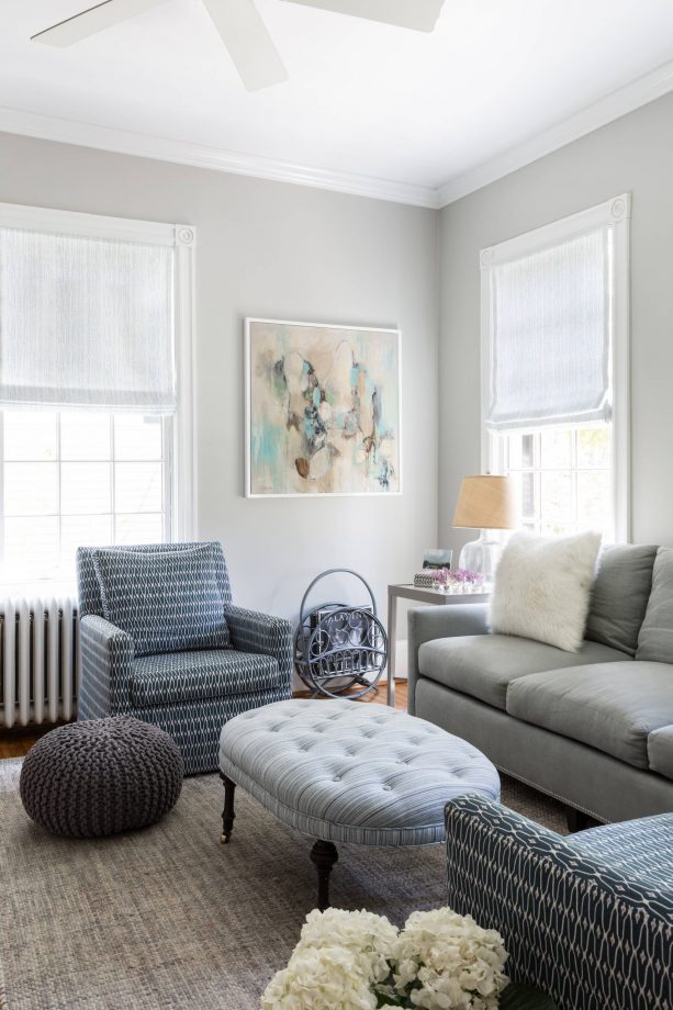 grey and blue transitional living room with cloud grey oval tufted ottoman