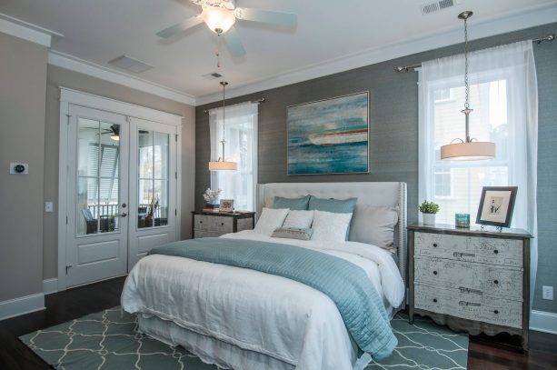 grey and white bedroom with blue accents