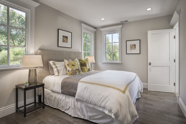 grey and white bedroom with corn yellow accents