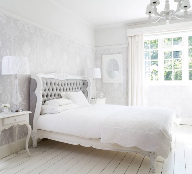 grey and white bedroom with white hardwood floor