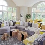 grey and yellow living room with yellow floral-patterned armless chair