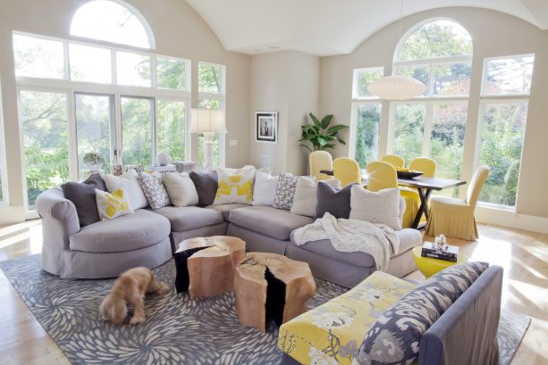 grey and yellow living room with yellow floral-patterned armless chair