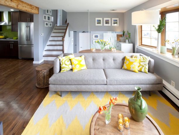 living room with chevron-patterned grey and yellow rug