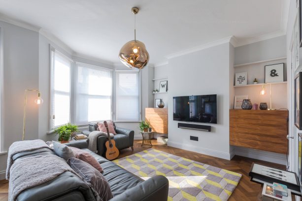 living room with zigzag grey and yellow rug