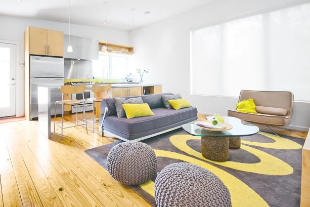 modern living room with grey and yellow oval-patterned rug