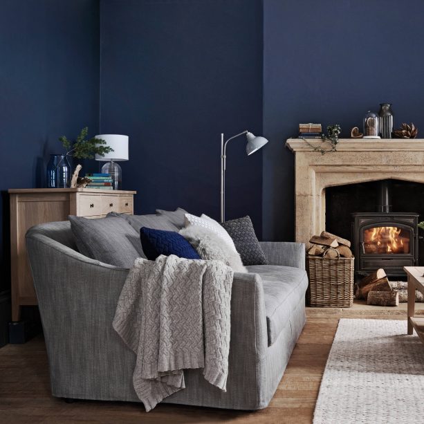 traditional grey and blue living room with indigo wall