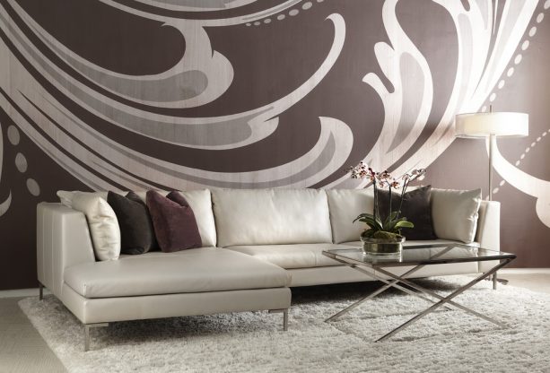 grey and brown living room with a mural pattern on the wall