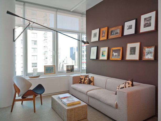 grey and brown living room with chocolate accent wall