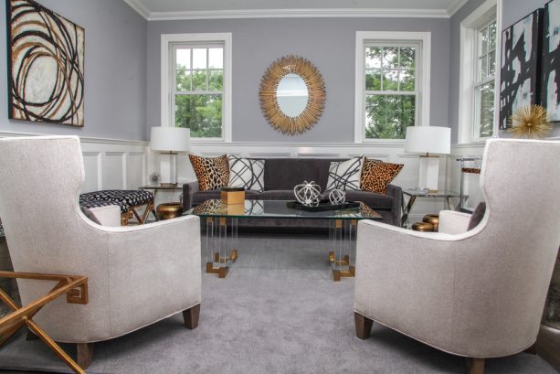 grey and brown living room with leopard print pillows