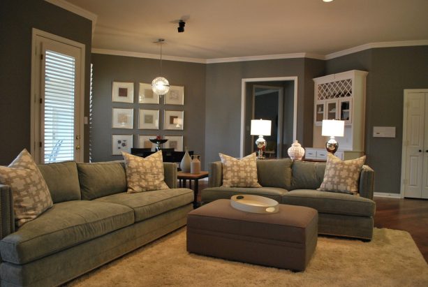 grey and brown living room with suede couches and upholstered table