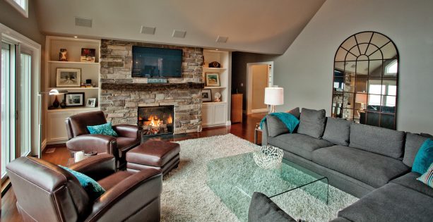 grey and brown living room with teal accents