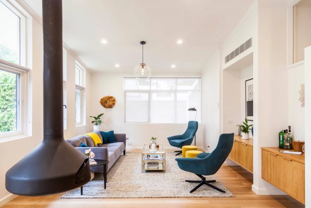 grey and teal living room with the mixture of modern and midcentury styles