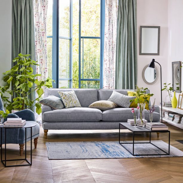 grey living room with herringbone wooden floor