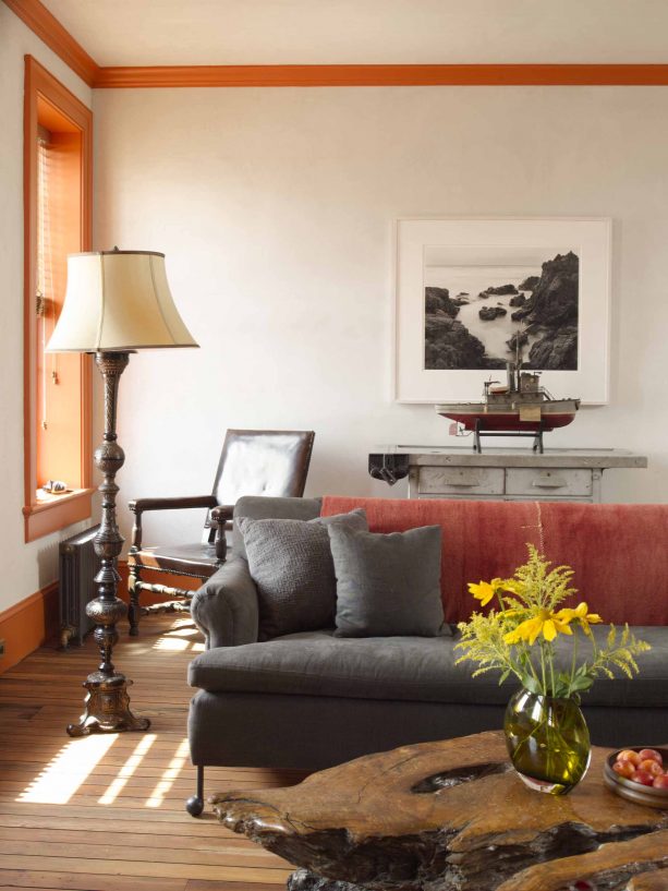 living room with grey, brown and orange color scheme