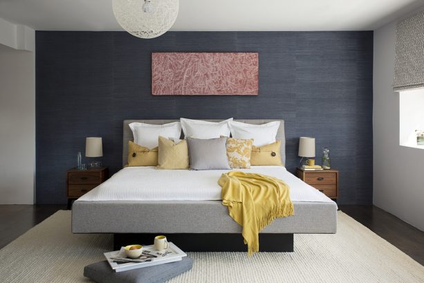 grey and yellow bedroom with charcoal grey accent wall