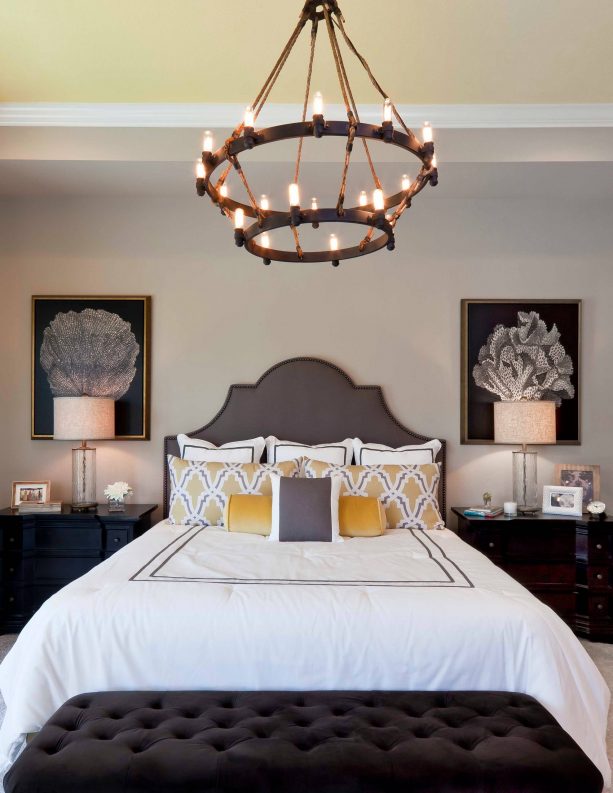 grey and yellow bedroom with traditional style chandelier