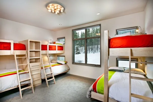 bedroom with light gray walls and red-white-lime green bedding set
