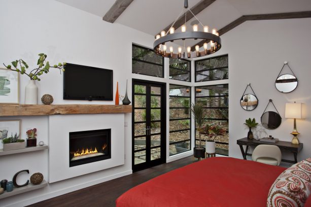 bedroom with light gray walls and scarlet red bedding set