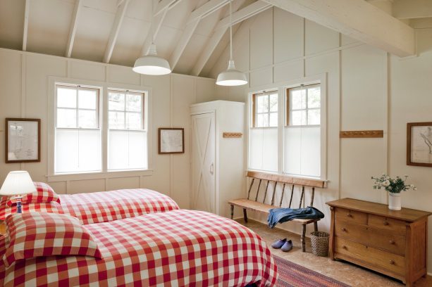 bedroom with warm gray walls and red and white checkered bedding