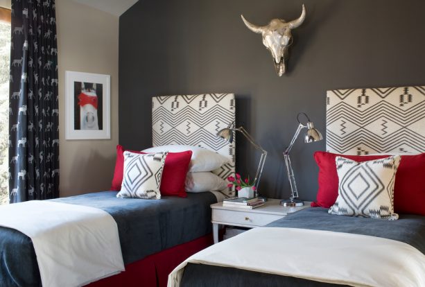 charcoal grey and red bedroom with double bed