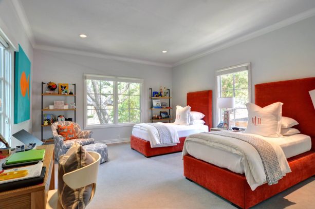 gray-dominated bedroom with red beds