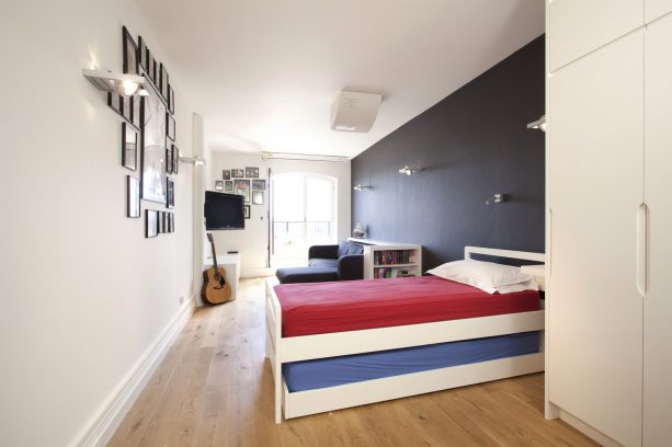 grey and red boys' bedroom with charcoal accent wall
