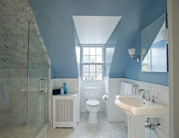 grey and white bathroom with a blue wall