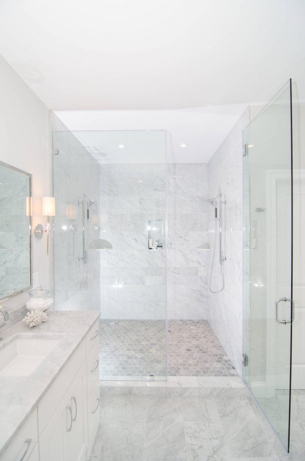 grey and white bathroom with frameless glass doors
