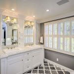 grey and white bathroom with patterned tile flooring