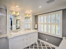 grey and white bathroom with patterned tile flooring