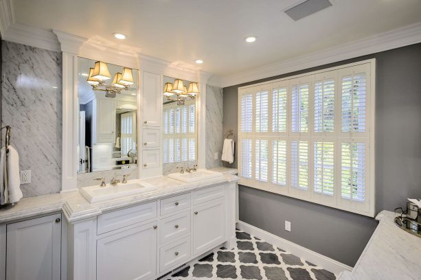 grey and white bathroom with patterned tile flooring