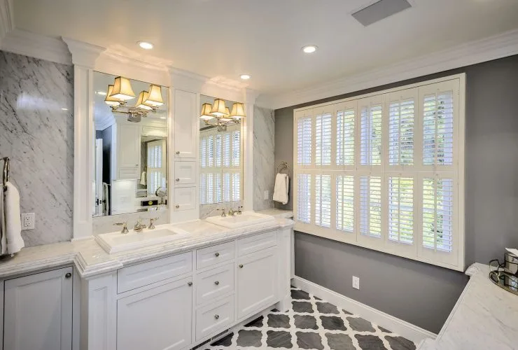 grey and white bathroom with patterned tile flooring