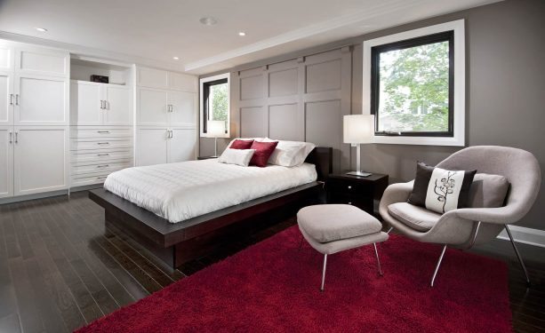 grey bedroom with fluffy red rug