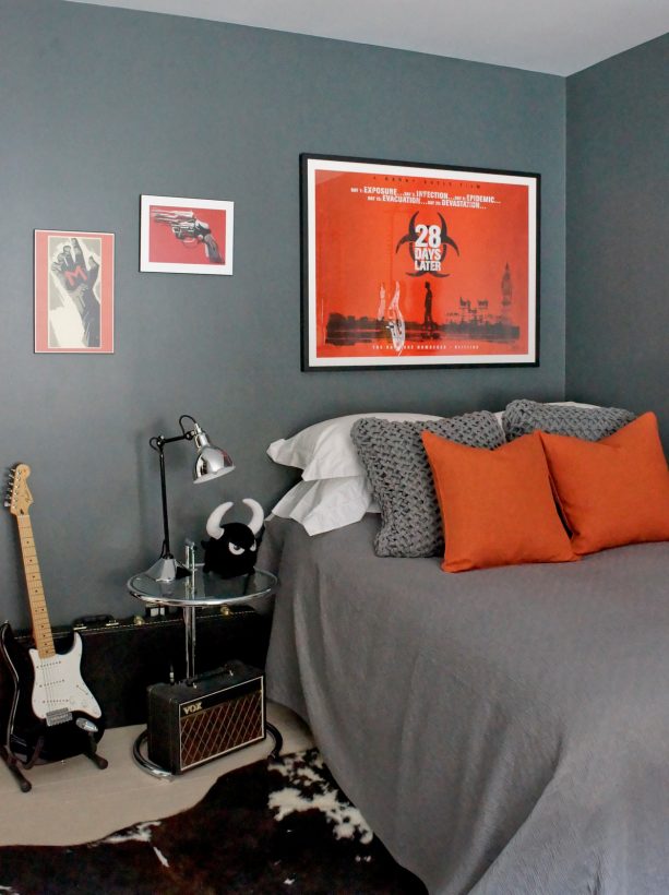 medium grey bedroom with stunning red wall art