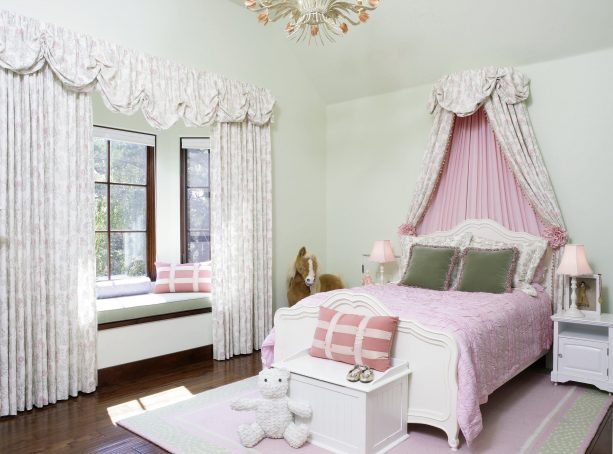 pink and grey bedroom with pink patterned wall-mounted bed canopy