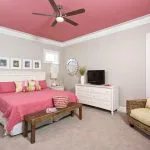pink and grey bedroom with rogue ceiling