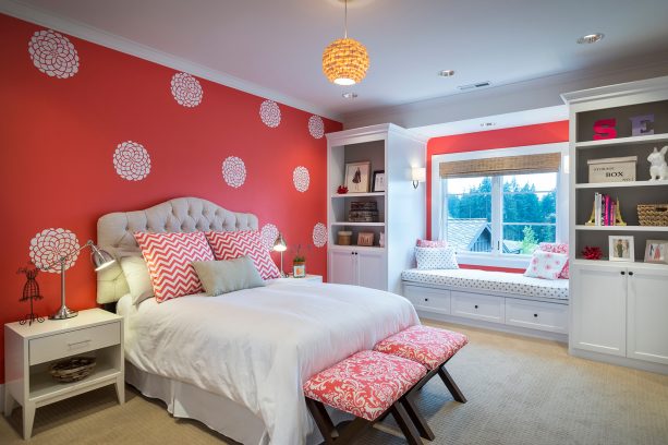 red and grey bedroom with a stenciled red wall